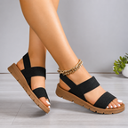 Sandalias planas con tiras elásticas®